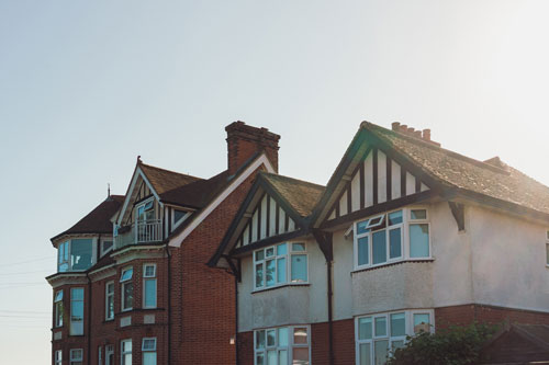 Hot sun beating down on roofs of houses